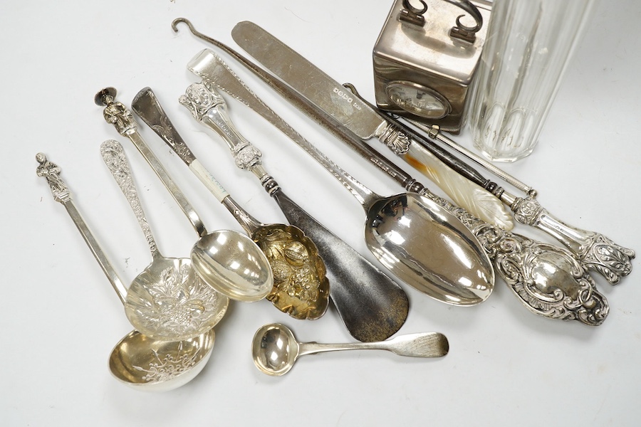 An Edwardian silver cased miniature carriage timepiece, by William Comyns, 67mm, London, 1901, together with a small quantity of assorted sterling or silver items, including flatware. Condition - poor to fair